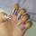 Diseño de uñas con animal print en blanco y morado/lila